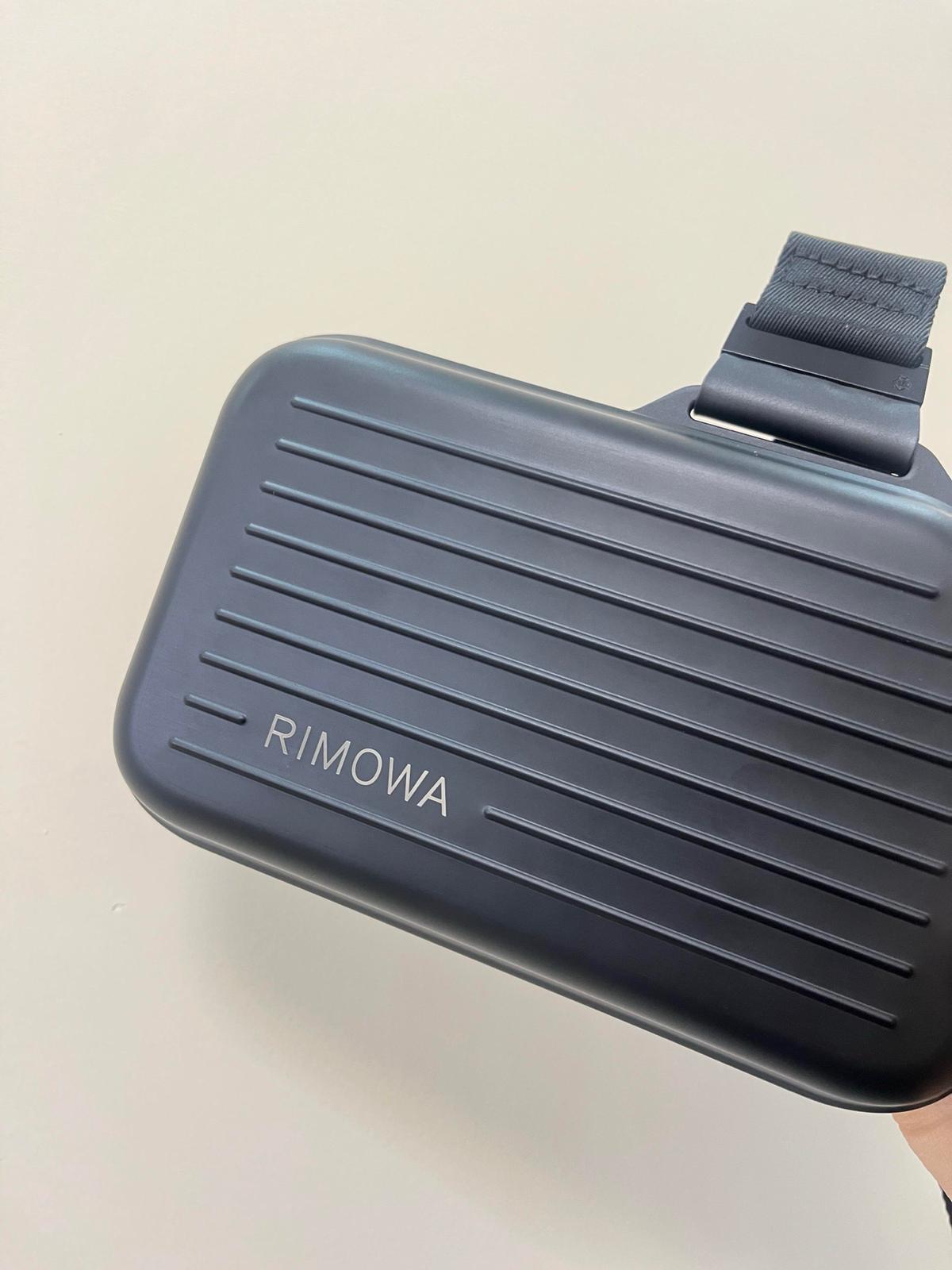 The RIMOWA Aluminum Logo Sling Clutch