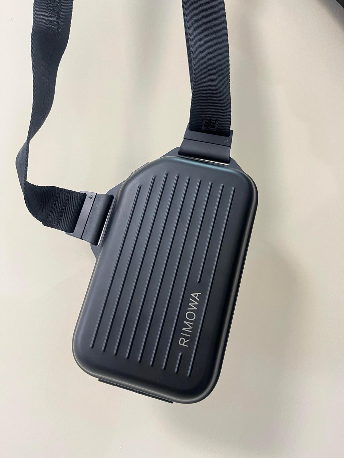 The RIMOWA Aluminum Logo Sling Clutch