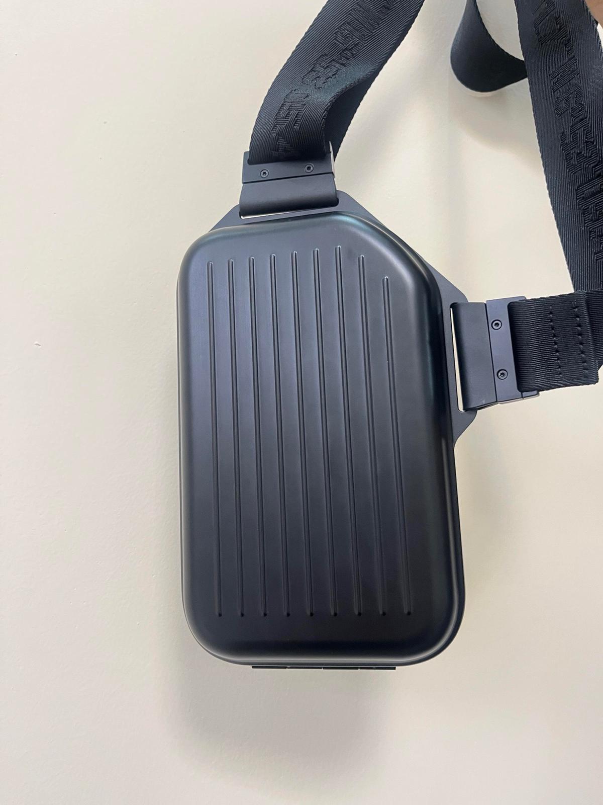 The RIMOWA Aluminum Logo Sling Clutch