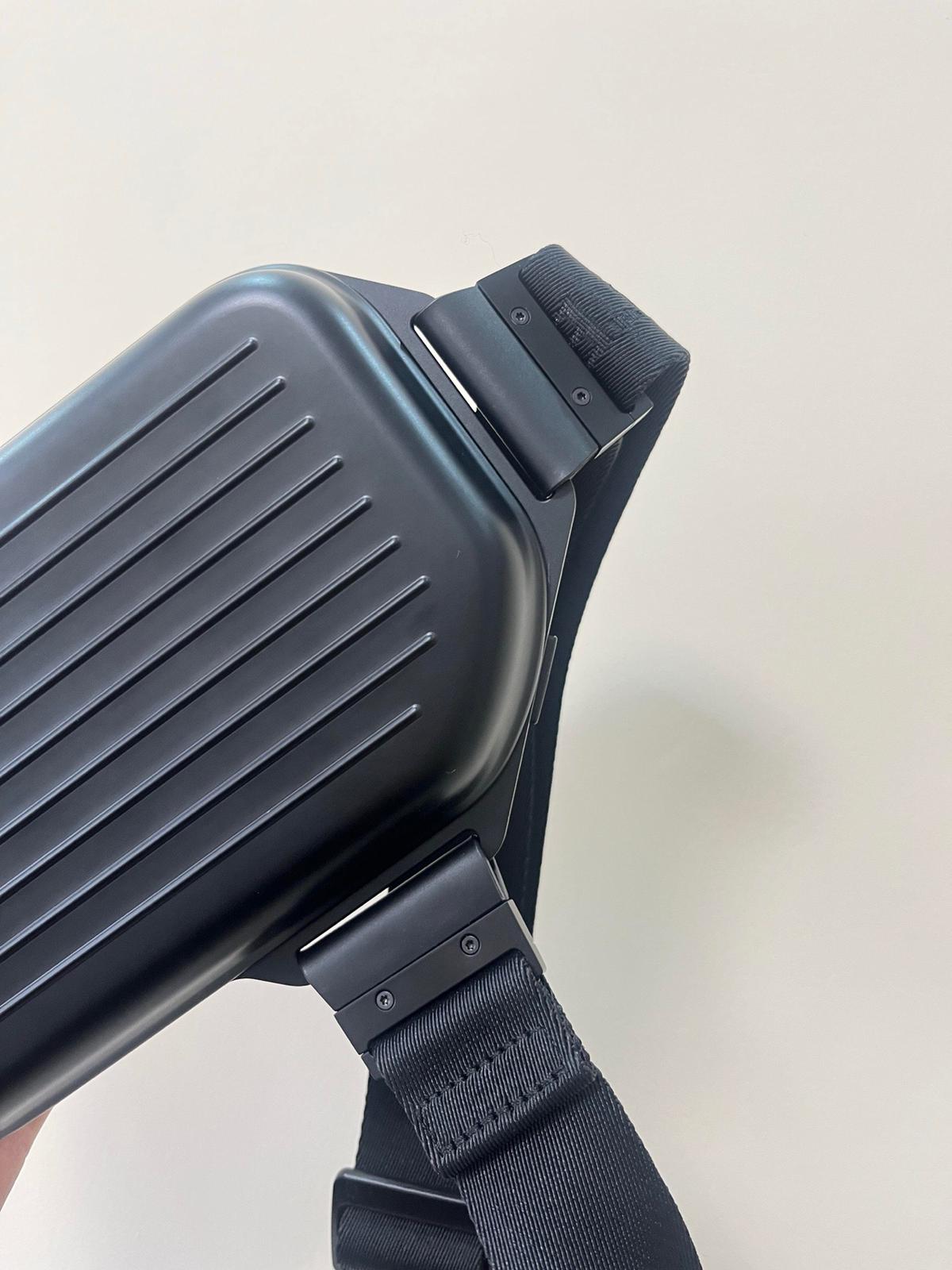 The RIMOWA Aluminum Logo Sling Clutch